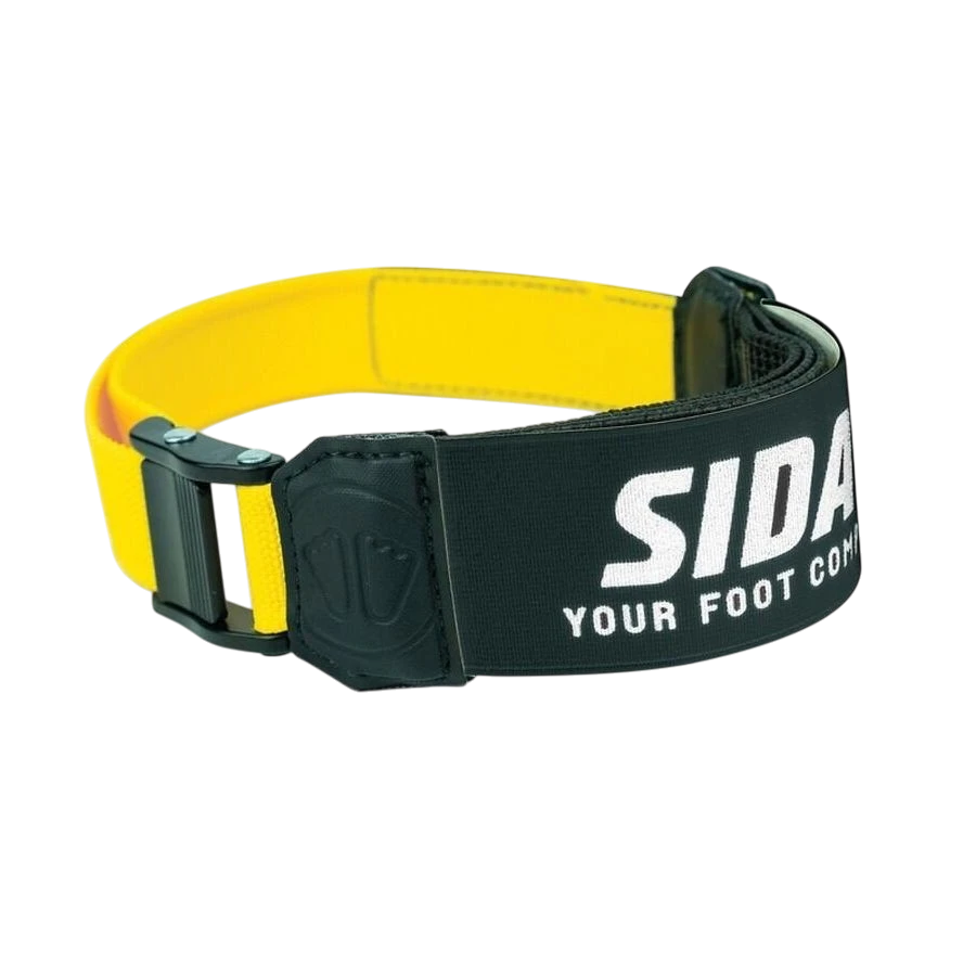 skidvalla.se Sidas Power Strap P4, a stiff elastic ski boot strap with a black and yellow design and metal buckle.